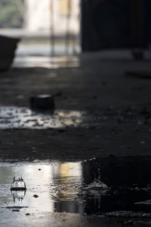 image of rain hitting the ground